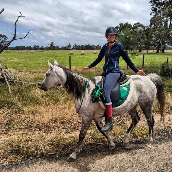 Riding Rahni bridleless down a country road